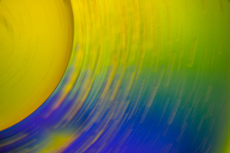 in the upper left corner there is a yellow circle turning into blue and green colors, the transition is in motion. suitable for screensavers on the desktop of a computer, mobile phone or tabletの写真素材