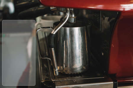 Old coffee machine, with one iron mug, espresso is poured into it. Vintage photo with white place for your insert (text, recipe, picture)の写真素材