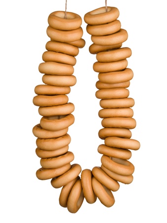 Sheaf of tasty bagels isolated on white backgroundの写真素材