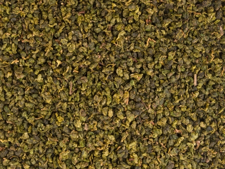 Dry green oolong tea leaves texture backgroundの写真素材
