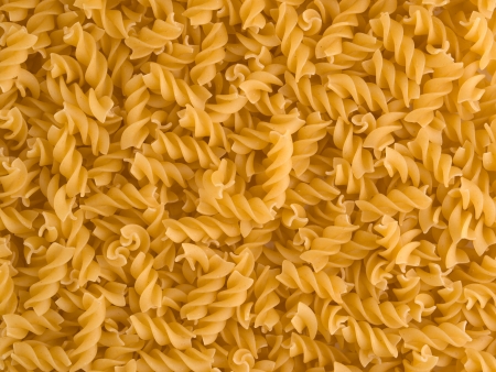 Raw italian uncooked pasta pastry background textureの写真素材