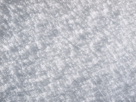 Snow high-contrast white surface texture, winter backgroundの写真素材