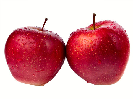 Two  wet red apples with droplets isolated on white backgroundの写真素材