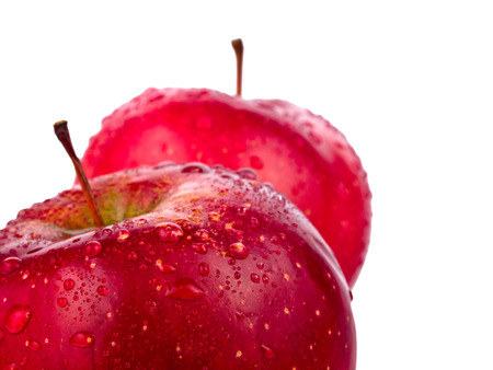 Two wet red apples with water drops isolated on white backgroundの写真素材