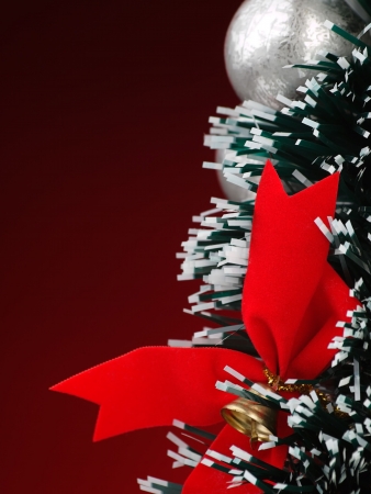 Christmas decoration over red background, for various christmas related themes and backgroundsの写真素材