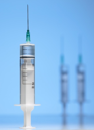 three syringes ,selective focus and blue toned, for  medical,health care or pharmacy themesの写真素材