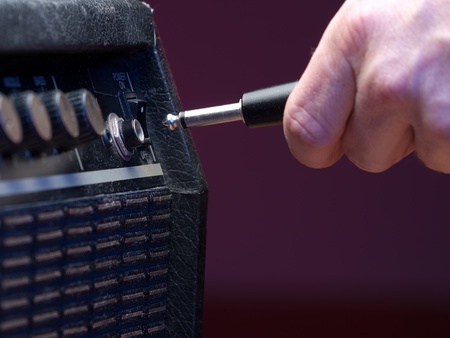 plugging into   the amplifier, closeup, for music,entertainment themesの写真素材