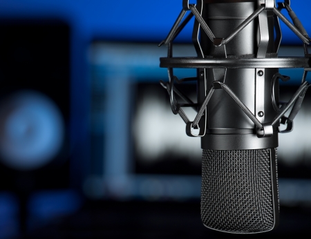 Microphone in the music recording studio , focus on the microphone, for music production,audio,entertainment themes Microphone in the music recording studio , focus on the microphone, for music production,audio,entertainment themes