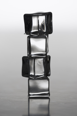 Clear stacked ice cubes, backlit,for cold, winter related themesの写真素材