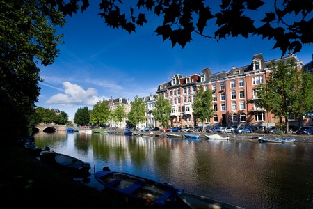 View of a channel and buildings in Amsterdam, Netherlands.の写真素材