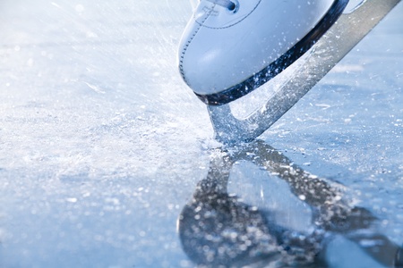 Woman skates braking ice, frazil flying around Woman skates braking ice, frazil flying around