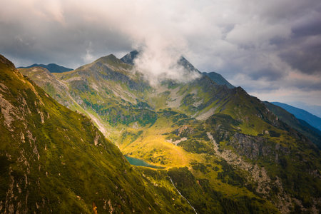 Unterer Kaltenbachsee lake lit in sunlight in Solkpass, Austria