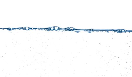 Steady water surface with bubbles and other small ones below on white backgroundの写真素材