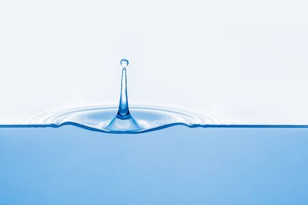 Cross section of ripple created by one fallen drop, water underneath, copy spaceの写真素材