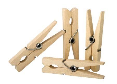 wooden clothes pins isolated on the white background