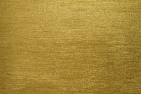 texture of a cement wall covered with gold paint with long strokes