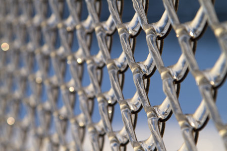 chainlink fence, covered with ice after freezing rain, as backgroundの写真素材