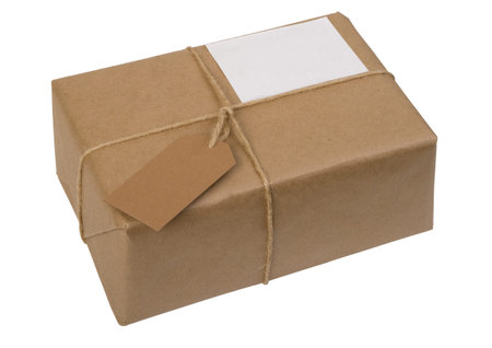 brown paper package tied with string with  label, isolated on whiteの写真素材