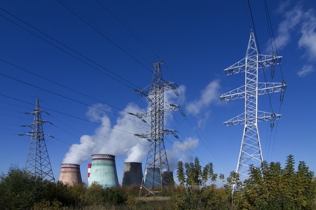  high voltage power pylons on against a thermoelectric plantのeditorial素材