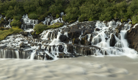 The waterfall Hraunfossar in the land of Gilsbakki at the edge of Hallmundarhraun.の写真素材