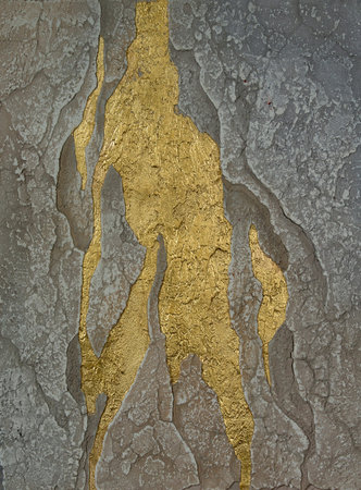 wall texture with cracks and golden spotsの写真素材