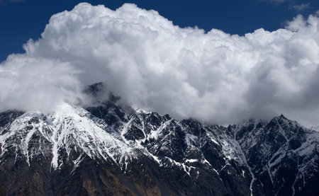 View of Snow Mountain Range Landscape with Blue Sky. Russia, Caucasus.