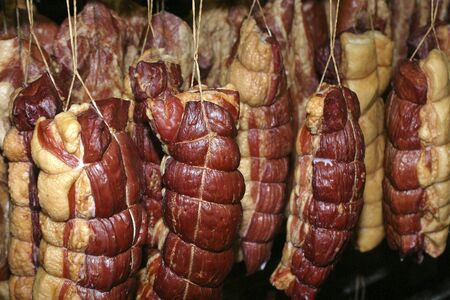 Smoked meat production line. Meat on the counter for the smokehouse.の写真素材