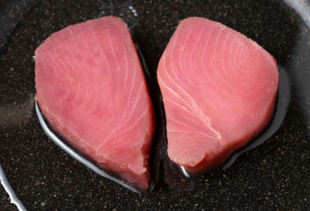 Fresh Raw tuna steak in a pan. top view. close up.の写真素材