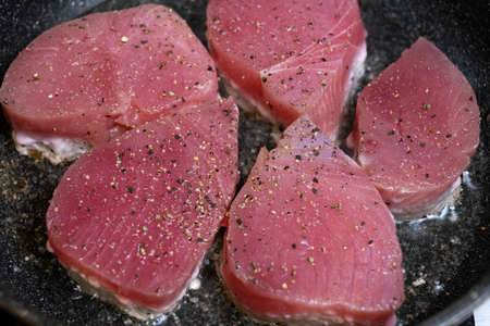Fresh Raw tuna steak in a pan. top view. close up.の写真素材