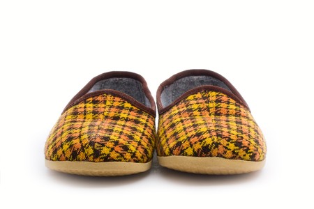a pair of kid's slippers isolated on whiteの写真素材