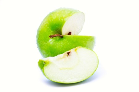 juicy green apple isolated over whiteの写真素材