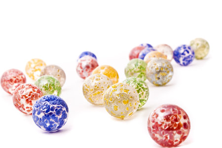colorful decorative glass balls isolated on white の写真素材
