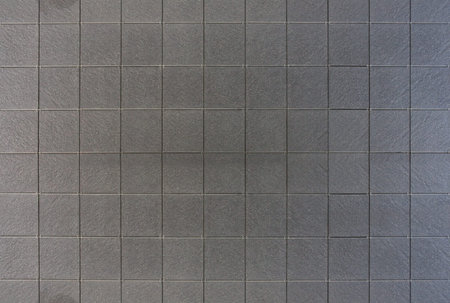 shot of a grey tile wall as background