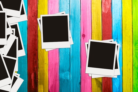 blank photos on vintage multicolored wooden backgroundの写真素材