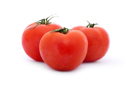 close up shot of red tomatoes isolated on white background の写真素材
