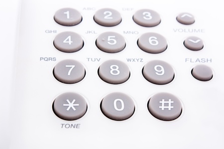 close up shot of grey and white phone keypad の写真素材