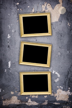 vintage concrete cracked wall with emty frames on it - artistic shadows added の写真素材