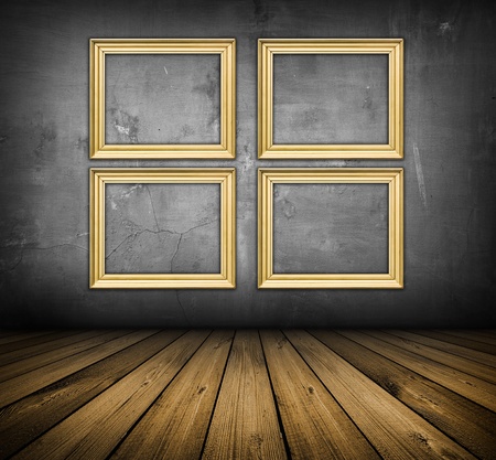 dark vintage interior with empty frames with copy-space hanging on the wallの写真素材