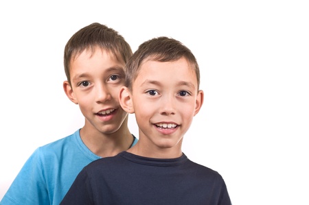 smiling twins isolated on white background happy together の写真素材