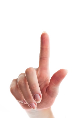 close up shot of female hand with a finger touching somethimg or pushing a button isolated on white background - shallow depth of fieldの写真素材
