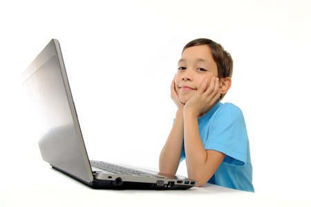 Boy with laptop isolated on white background の写真素材