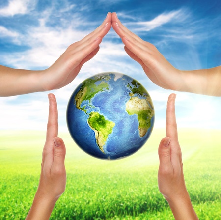 house made of female hands with planet earth globe inside の写真素材
