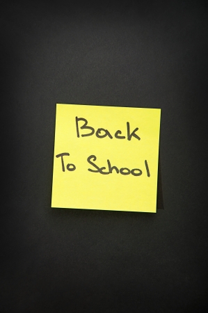 back to school yellow paper sticker on black の写真素材