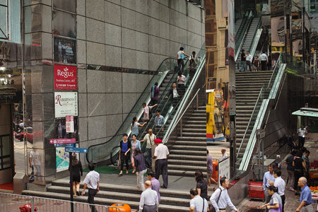 People are hurrying to work. Hong Kong Special Administrative Region of the People's Republic of China, is a city on the southern coast of China at the Pearl River Estuary and the South China Seaのeditorial素材