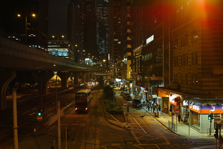 Urban districts of Hong Kong at night. Skyscrapers, heavy dilapidated houses, all mixed up. Hong Kong Special Administrative Region of the People's Republic of China, is a city on the southern coast of China at the Pearl River Estuary and the South China のeditorial素材