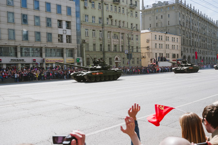 MOSCOW-MAY 9, 2015: Victory parade dedicated to the 70th anniversary of the Soviet victory over Germany. People on the streets of Moscow greeted Pass technique. Organization of view of the parade for the common people.のeditorial素材
