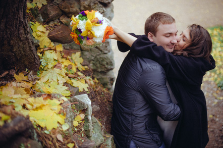 In love couple, pregnant woman and a young father in anticipation of their first child walk in the park.の写真素材