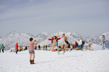 SOCHI, RUSSIA-APRIL 2016: skiers in swimsuits jumping in front of cameraのeditorial素材