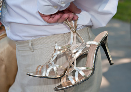 The man holding in a hand female barefoot personsの写真素材