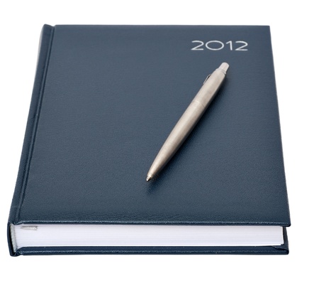 the daily log with a pen on a white backgroundの写真素材